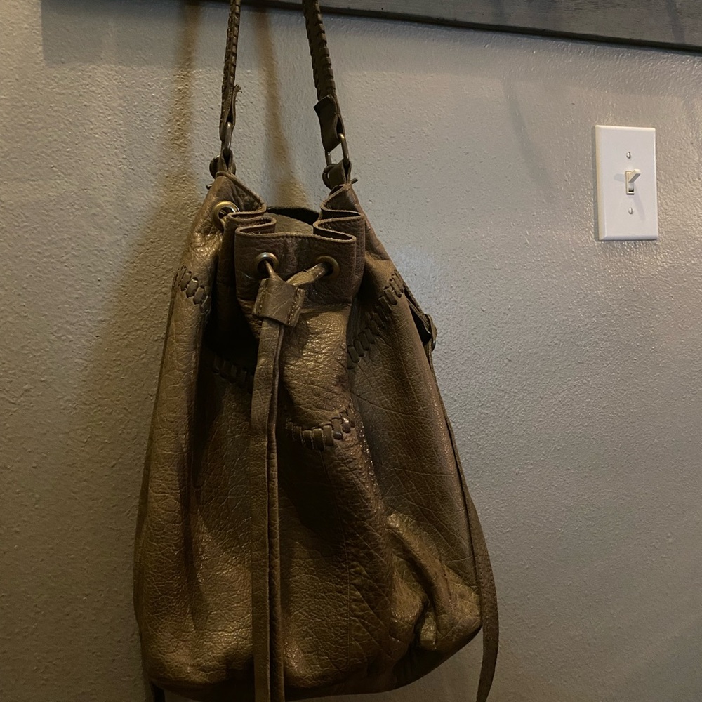 Soft boho green bag with crossbody strap.